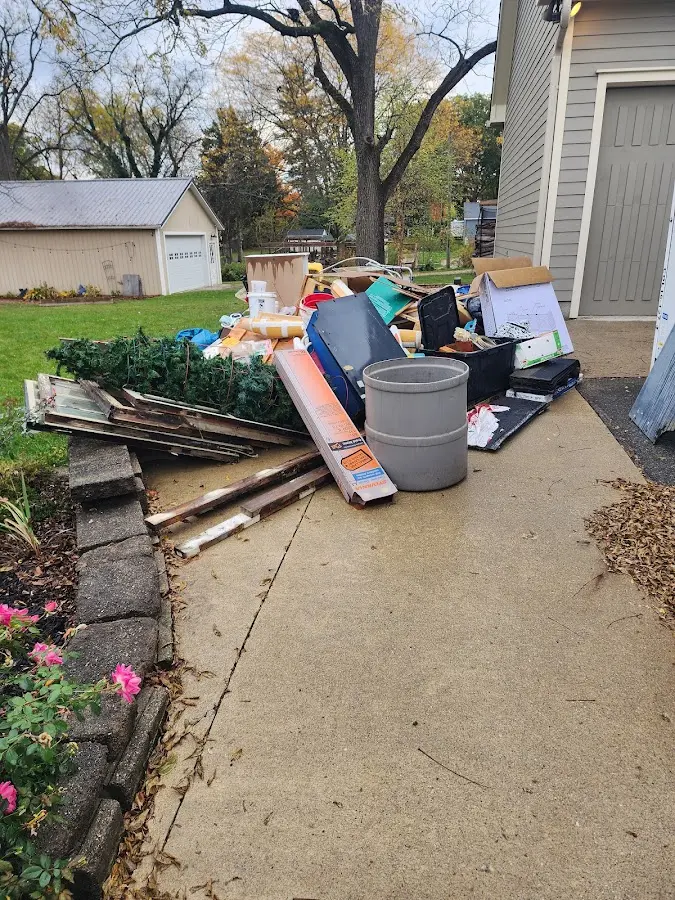 Dumpster being loaded with debris for Roofing Dumpster Rental in Lake Elsinore